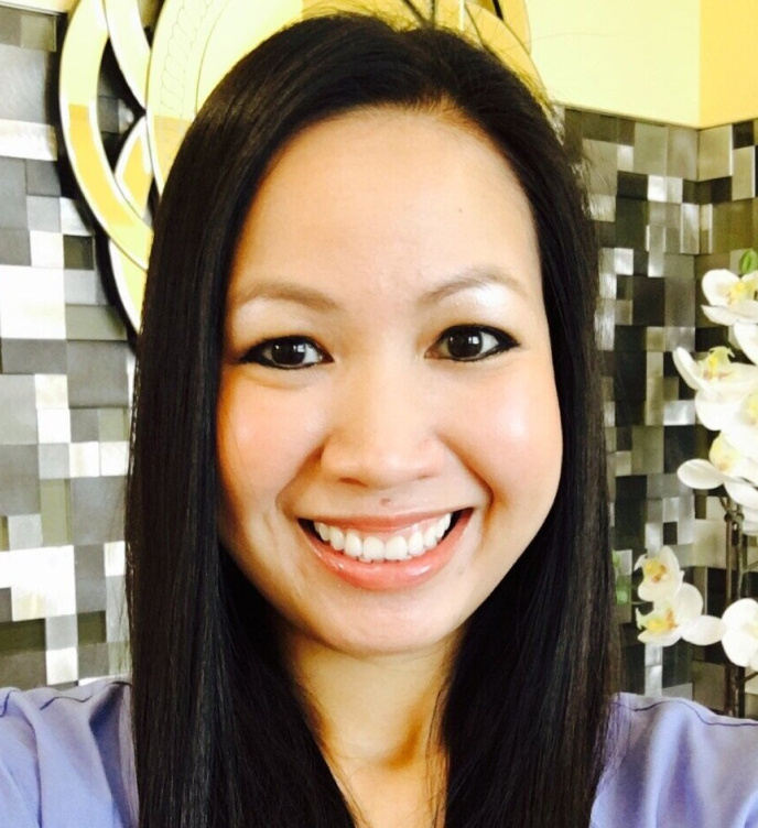 Dr. Aleeahna Phan smiling at Hapii Dental clinic in Austin, Texas.