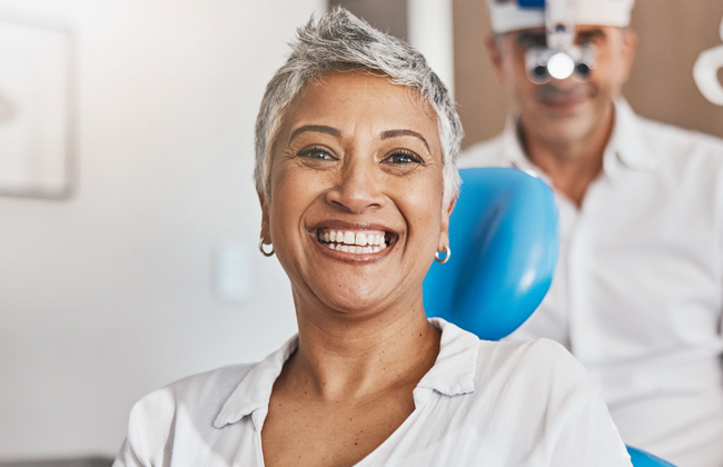 Smiling patient after successful oral surgery treatment at a dental clinic in Austin, TX