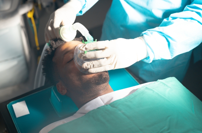 Patient receiving sedation dentistry with nitrous oxide mask to reduce dental anxiety in Austin Texas