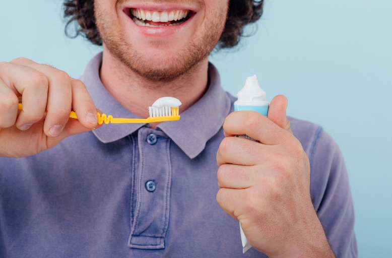 Austin teeth whitening patient brushing teeth but still having yellow teeth